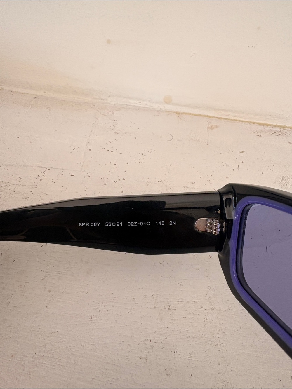 Prada Black Frame Sunglasses with Purple Lenses